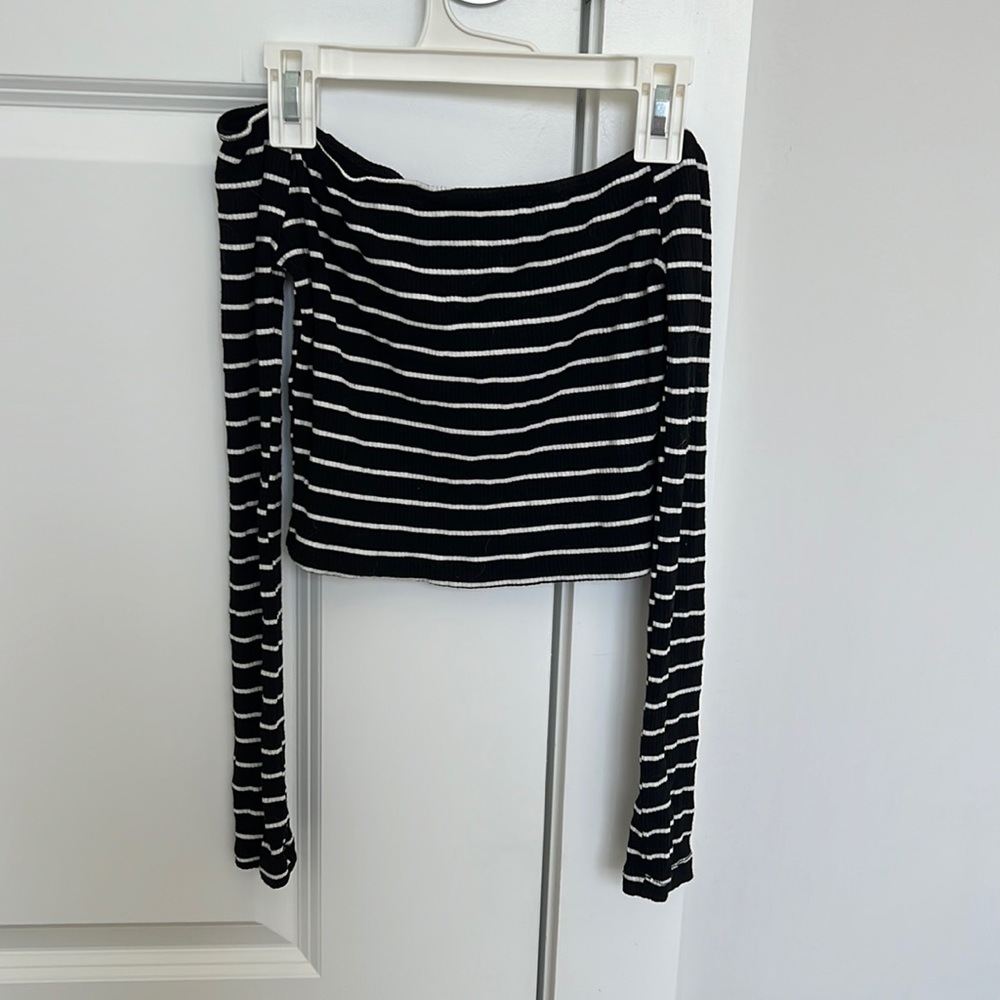 Off the shoulder long sleeve shirt.